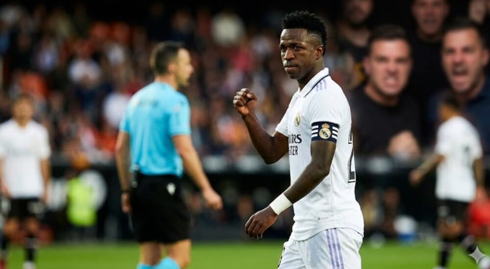 Vinícius Júnior Real Madrid football star in stadium emotional moment after FIFA racism ruling.