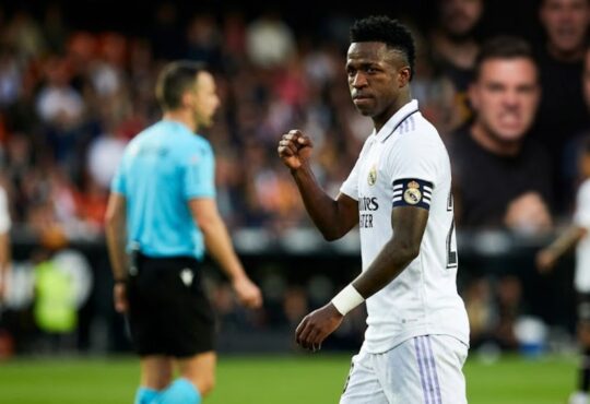 Vinícius Júnior Real Madrid football star in stadium emotional moment after FIFA racism ruling.